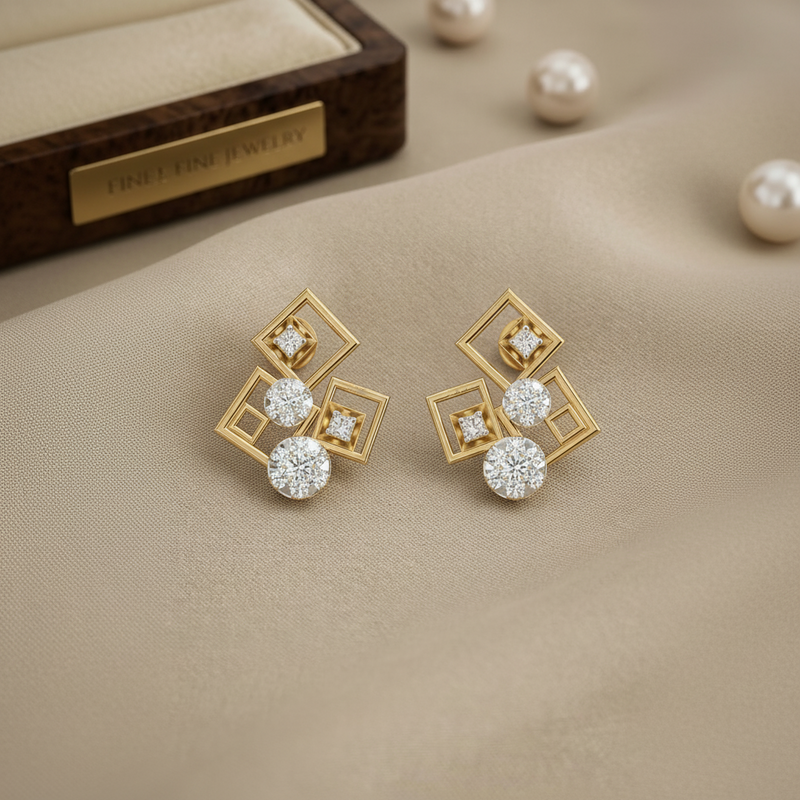 Gold earrings with diamond-like stones on a beige fabric background