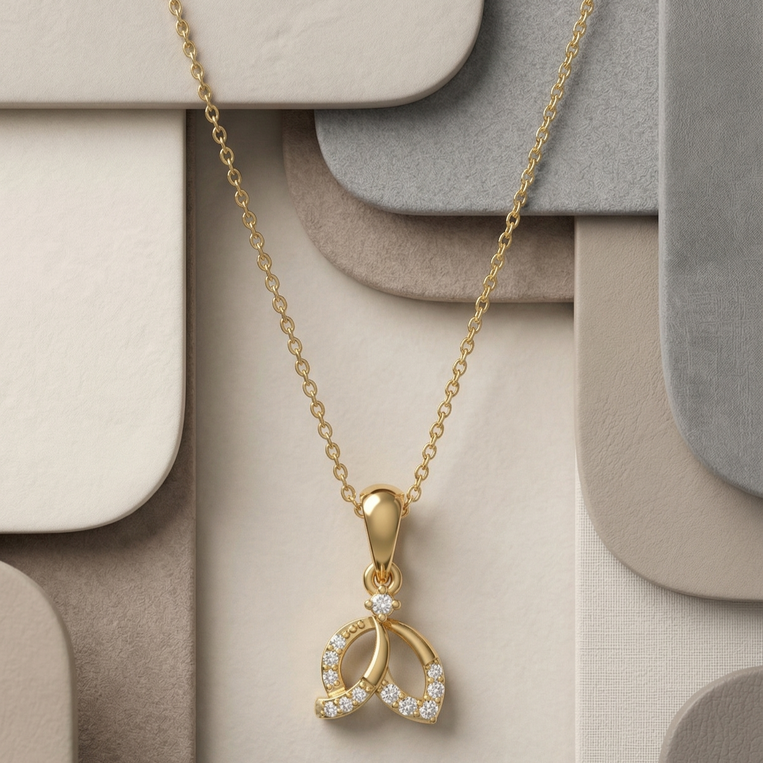 Elegant gold pendant necklace featuring a leaf-inspired design adorned with sparkling lab-grown diamonds on a geometric neutral background.