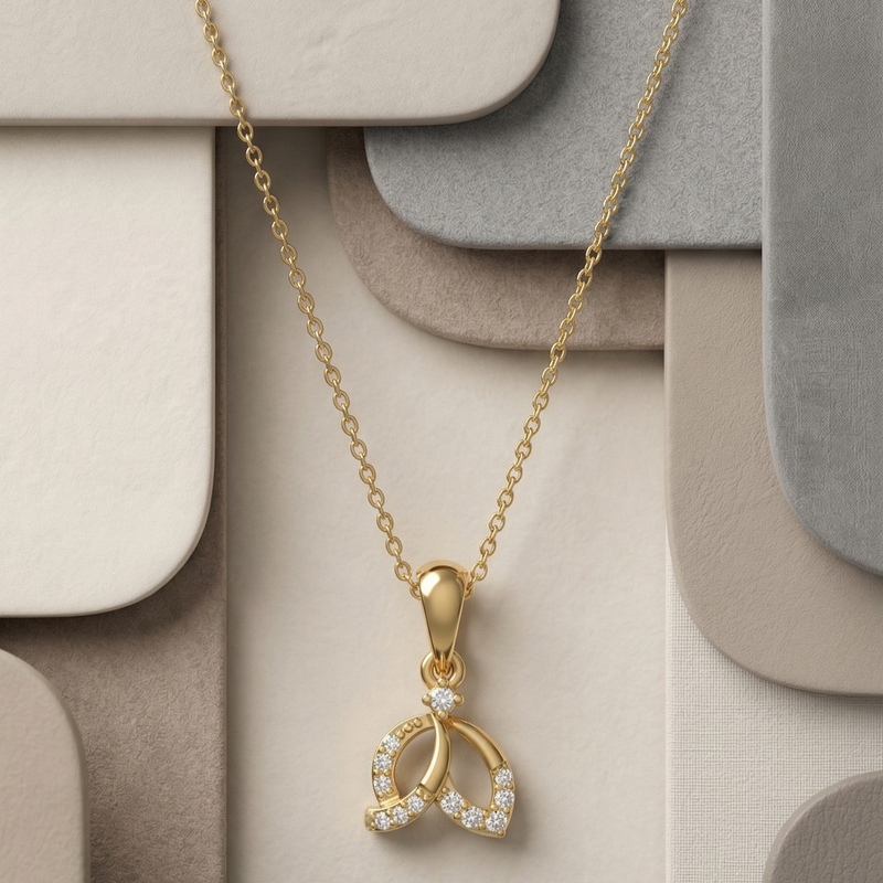 Elegant gold pendant necklace featuring a leaf-inspired design adorned with sparkling lab-grown diamonds on a geometric neutral background.