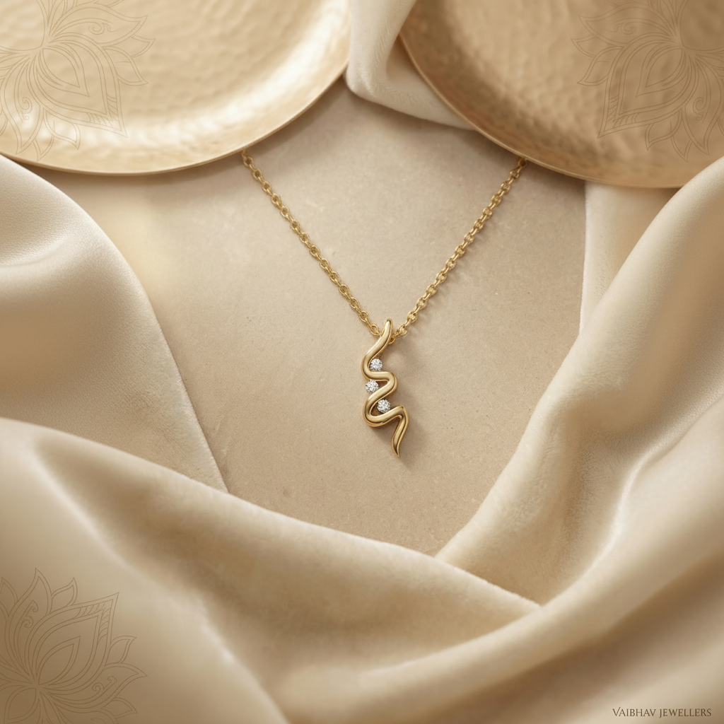 Elegant gold pendant necklace with a minimalist wave-inspired design and sparkling diamond accents, beautifully displayed on soft ivory satin fabric.