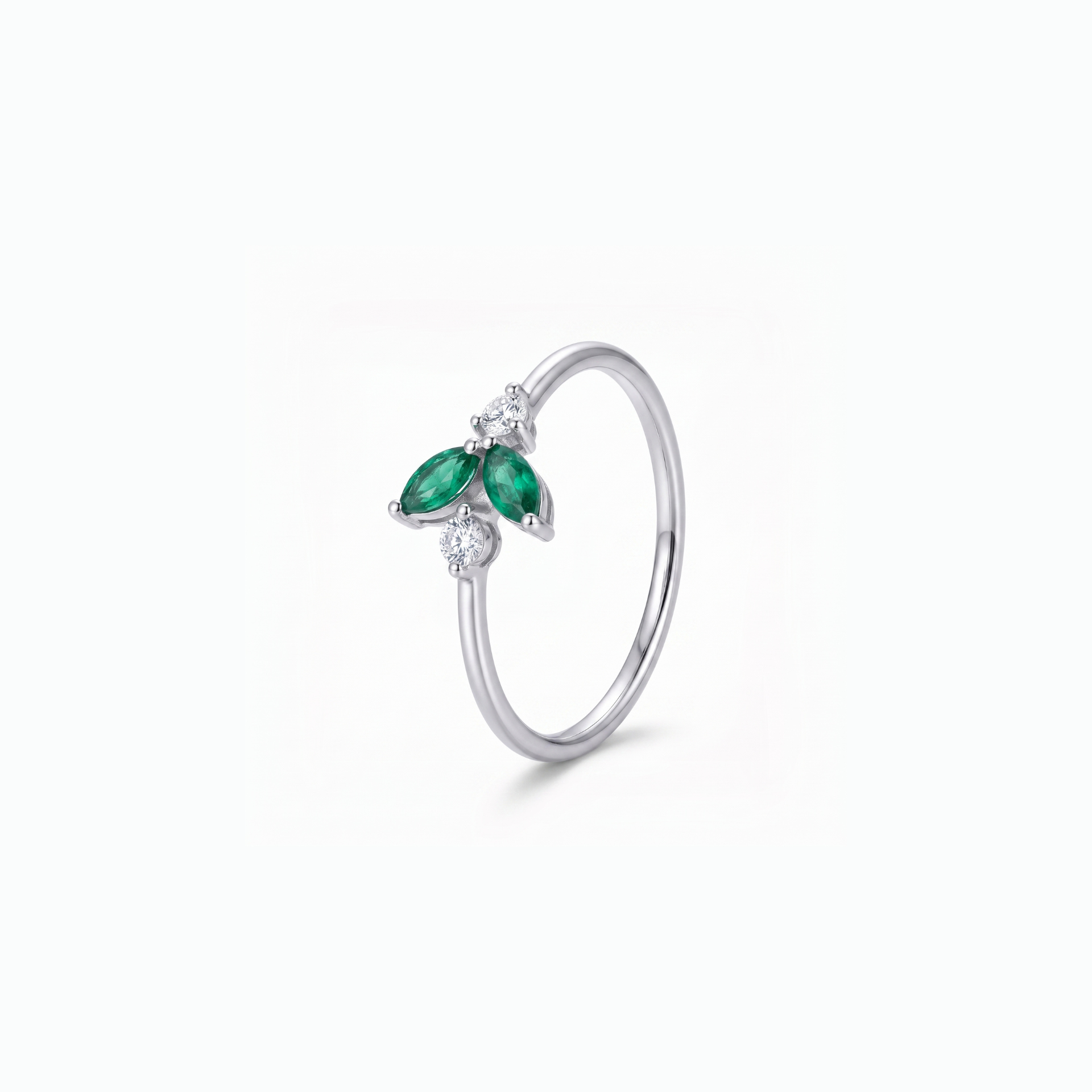 A silver ring featuring a butterfly design with two green marquise-cut stones and small clear accent stones, shown on a clean white background.