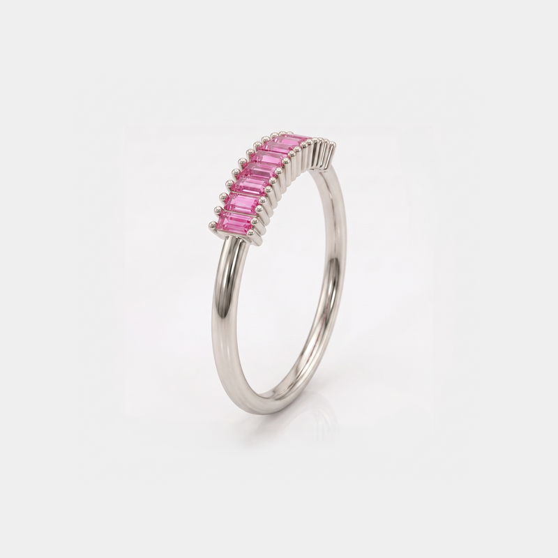 A silver band ring featuring a curved row of rectangular pink gemstones, set against a clean white background.