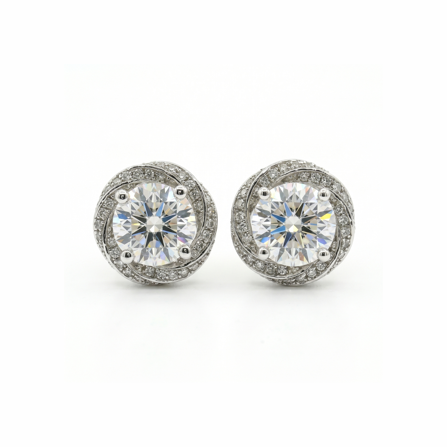 Pair of diamond stud earrings on a white background