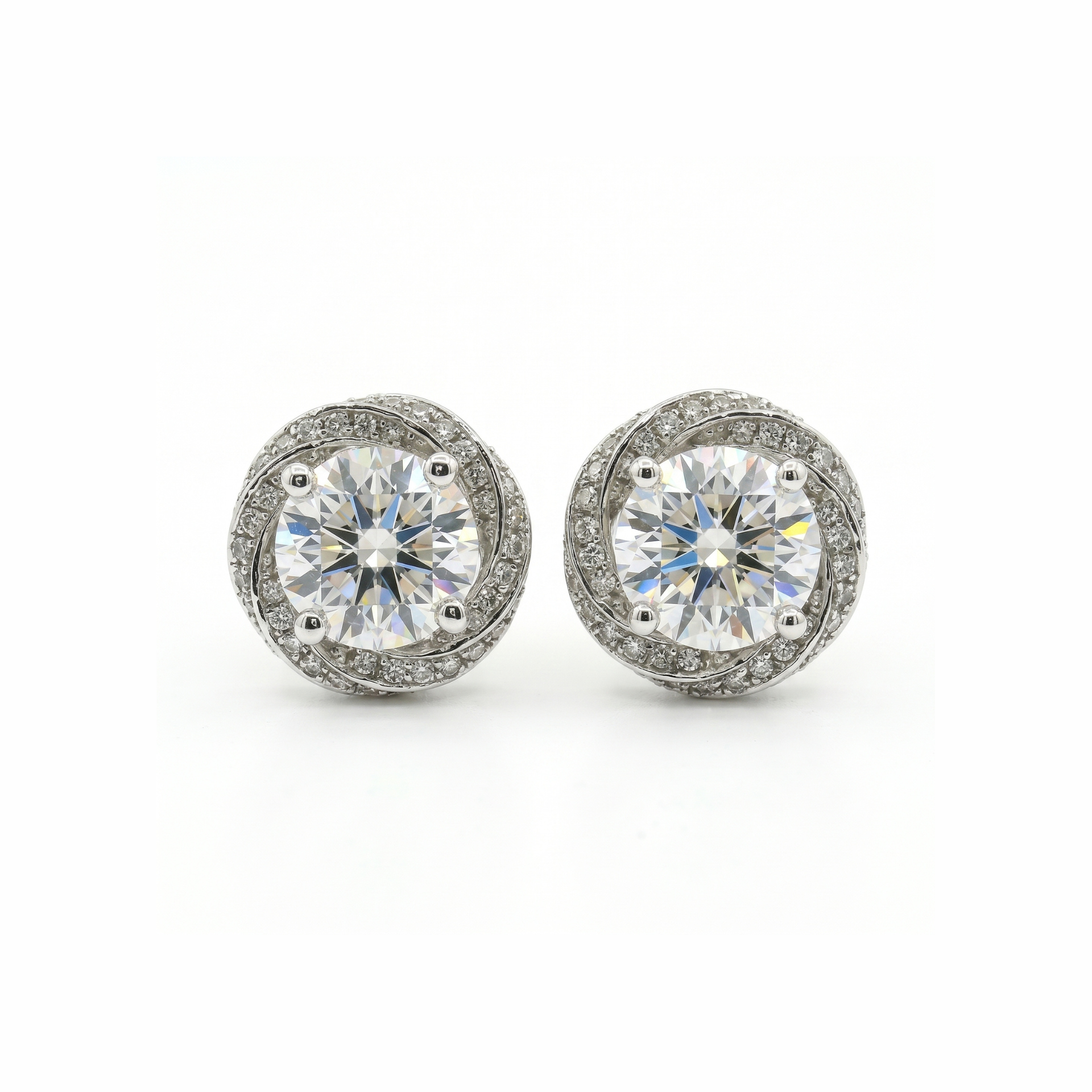 Pair of diamond stud earrings on a white background