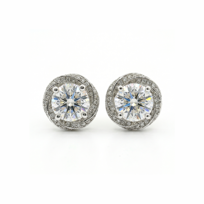 Pair of diamond stud earrings on a white background