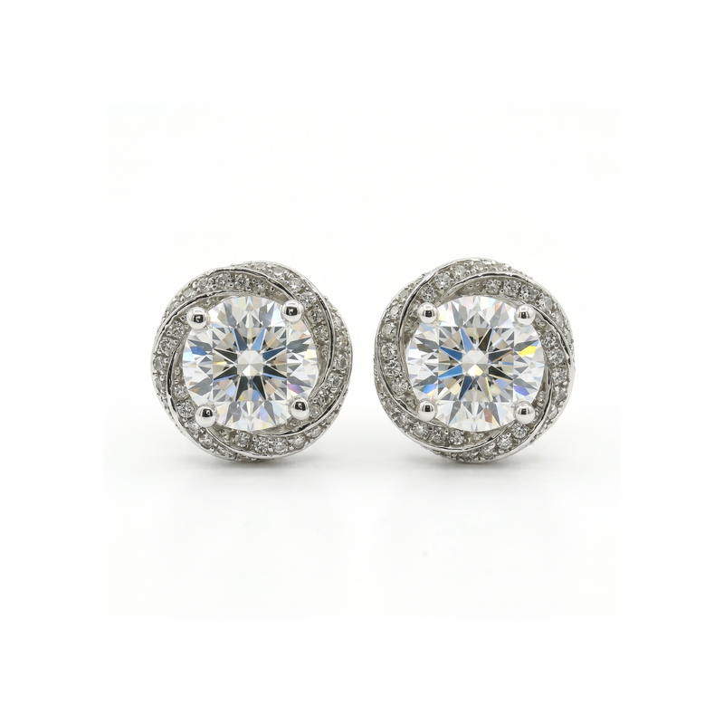 Pair of diamond stud earrings on a white background