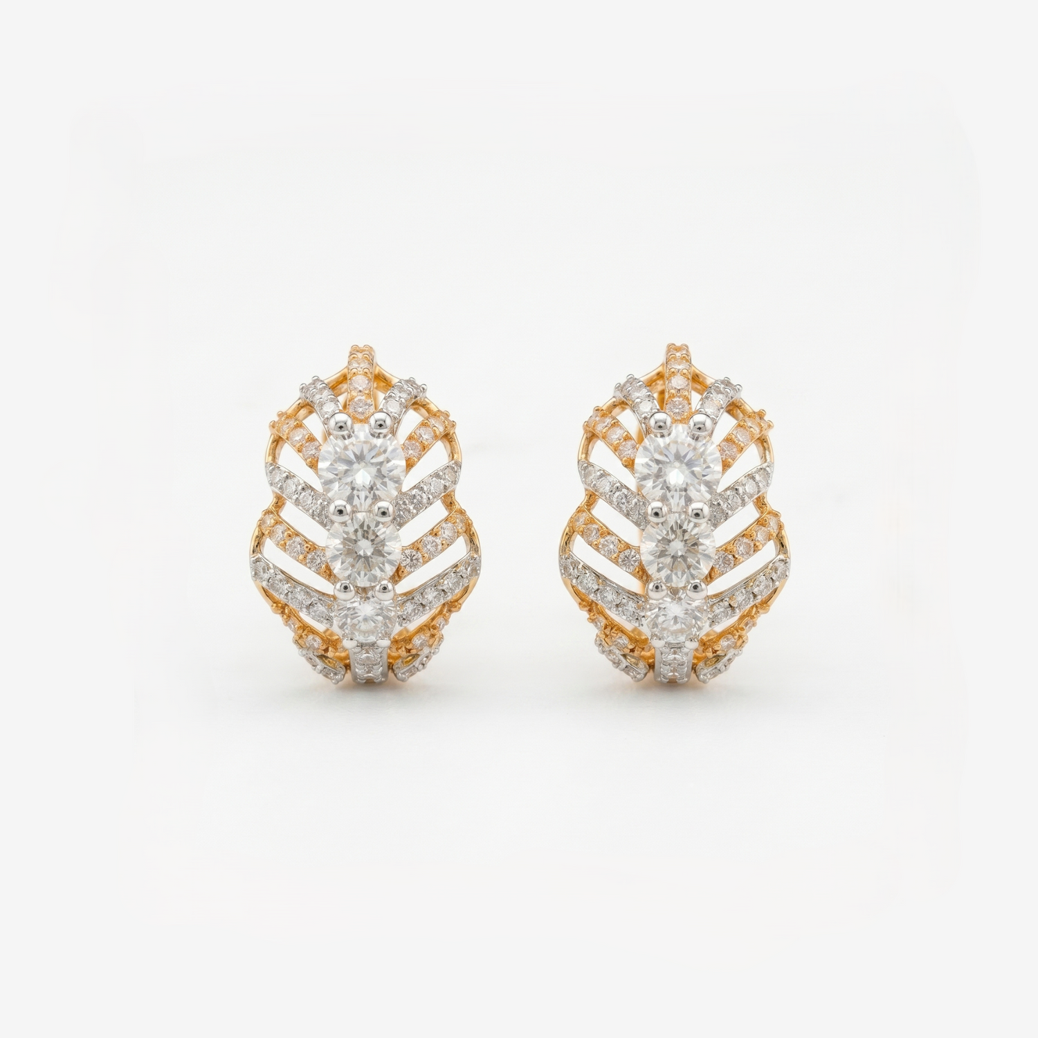 Geometric gold stud earrings featuring sparkling lab-grown diamonds on a white background.