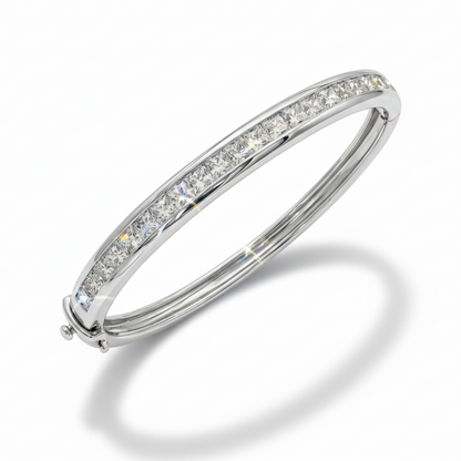 Silver bracelet with clear gemstones on a white background