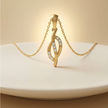 Gold necklace with a pendant on a white plate against a beige background
