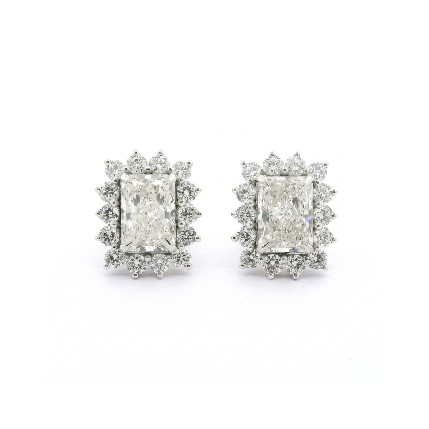 Pair of diamond earrings on a white background