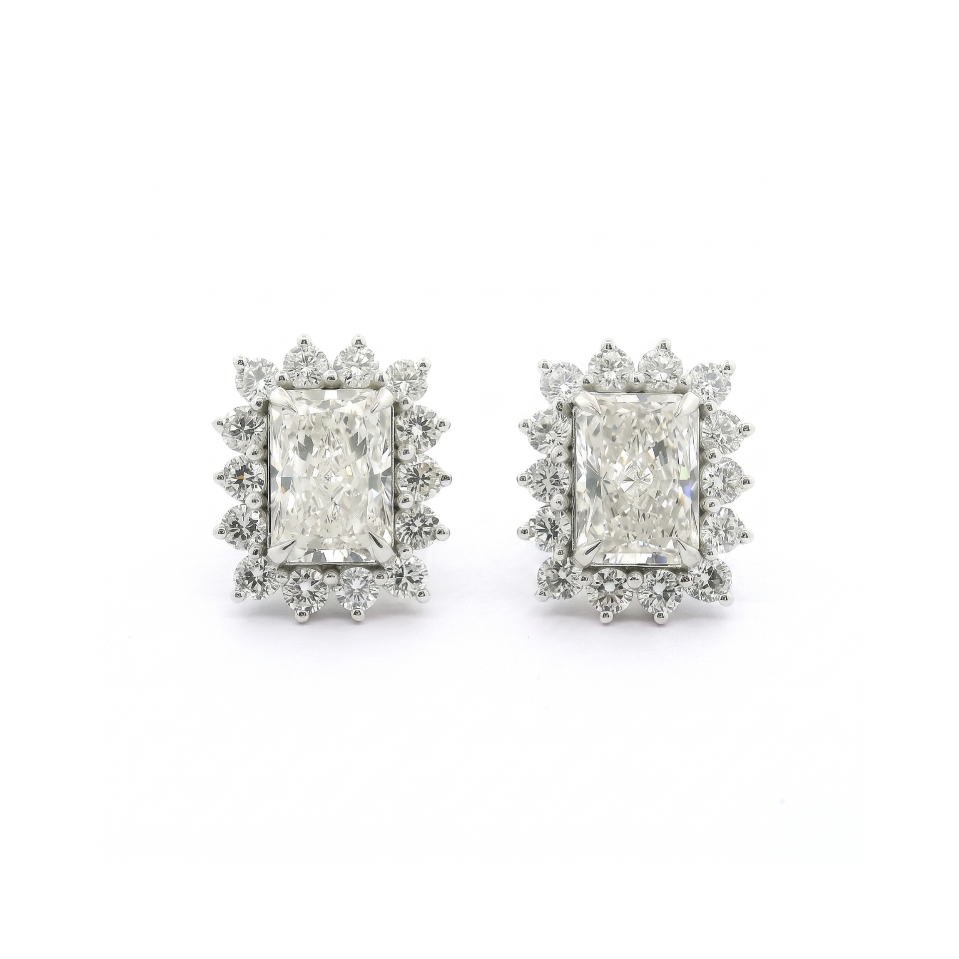 Pair of diamond earrings on a white background