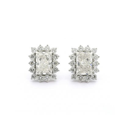 Pair of diamond earrings on a white background