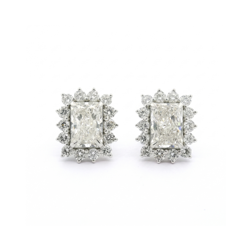 Pair of diamond earrings on a white background