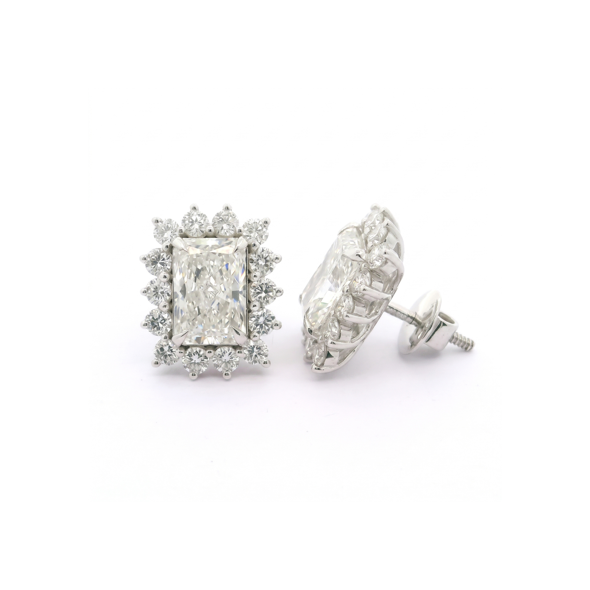 Pair of diamond stud earrings on a white background