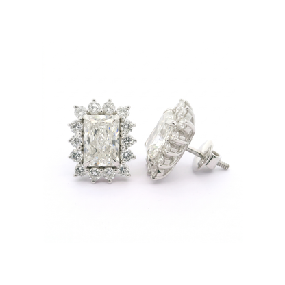 Pair of diamond stud earrings on a white background