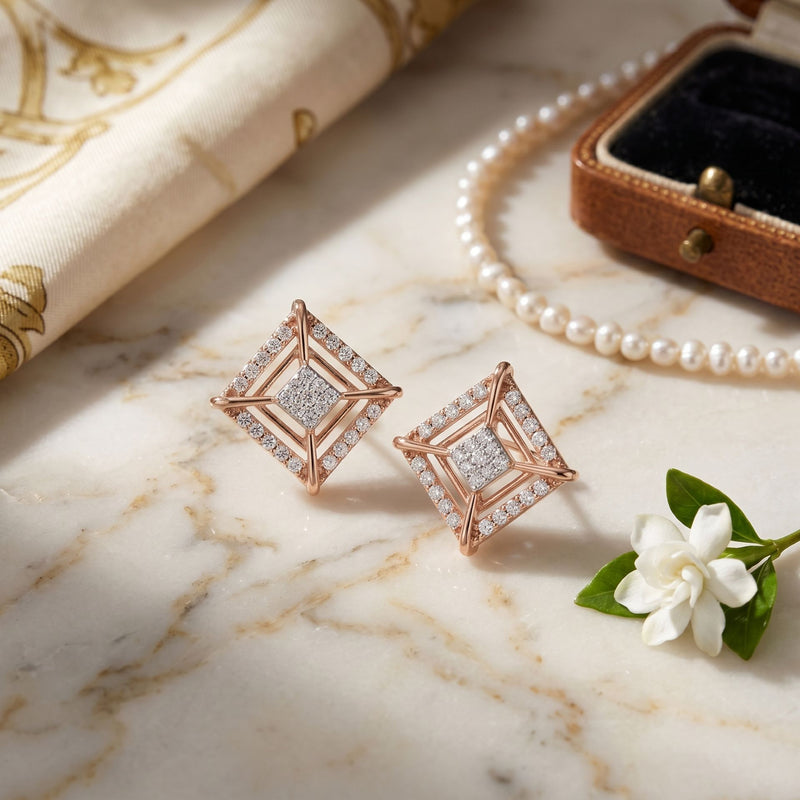 Rose gold geometric lab grown diamond stud earrings on a beige display