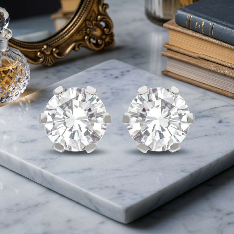 Floral lab grown diamond stud earrings on a marble display