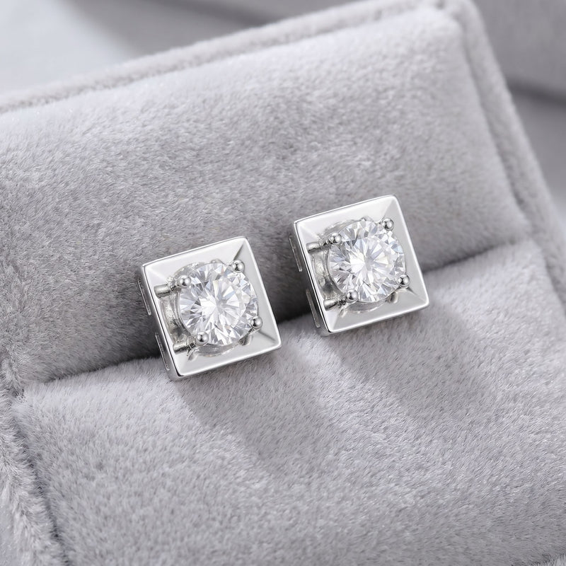 Square lab grown diamond stud earrings on a grey velvet cushion
