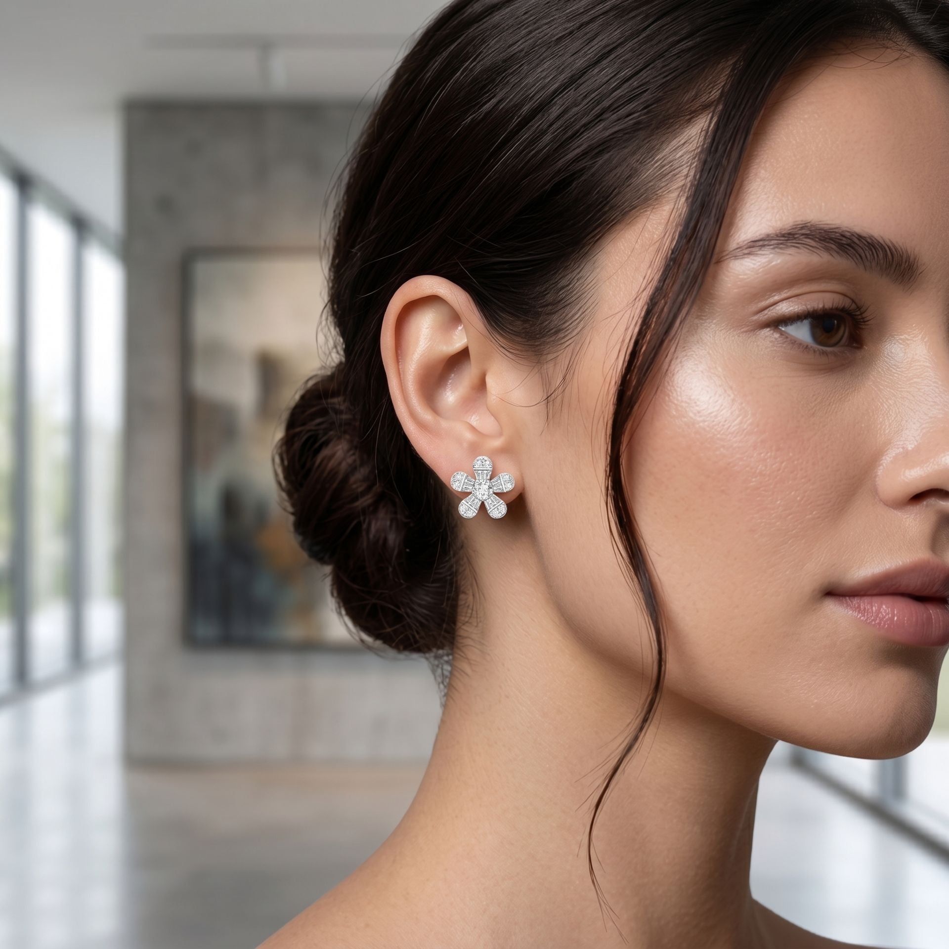 Woman wearing sparkling lab-grown diamond stud earrings in a close-up portrait.