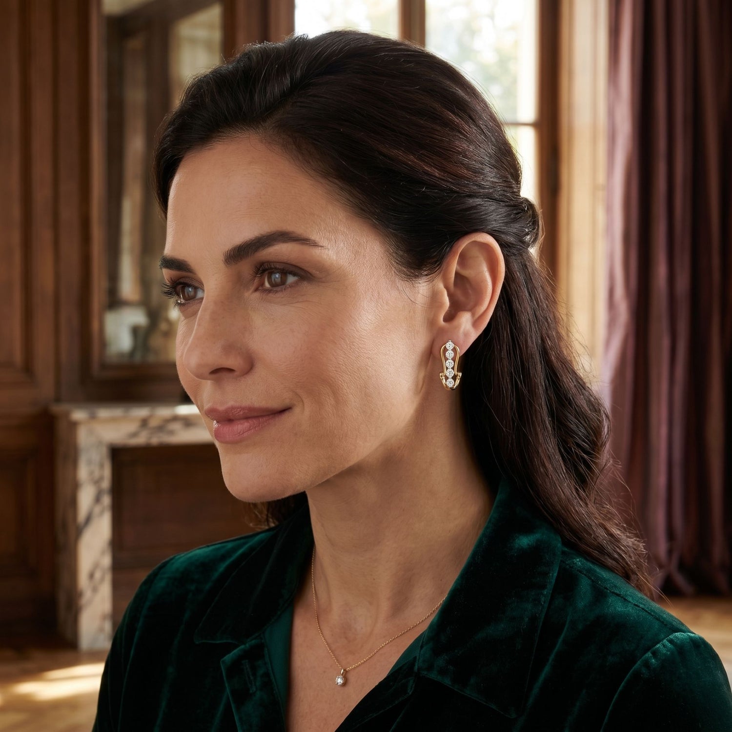 Woman wearing elegant geometric lab-grown diamond stud earrings in a close-up portrait.