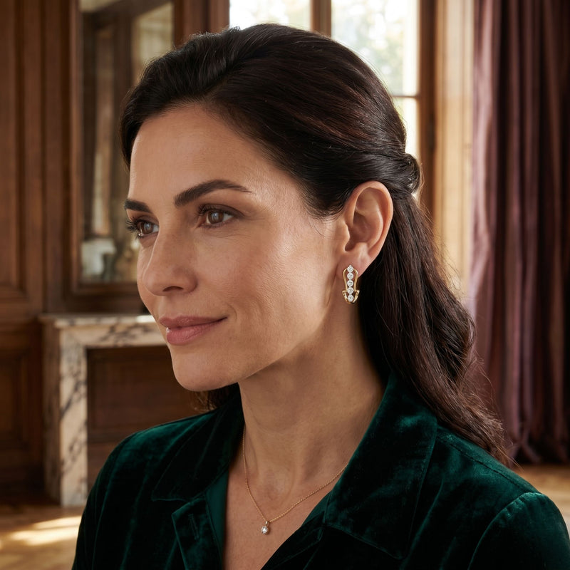 Woman wearing elegant geometric lab-grown diamond stud earrings in a close-up portrait.