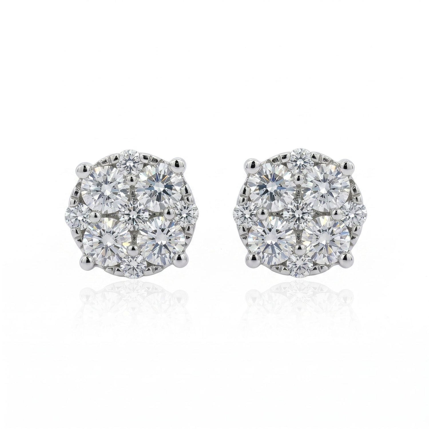 Pair of diamond stud earrings on a white background